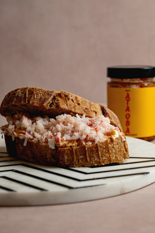 The Lagos Melt — ỌBÀ’S BLEND smashed avocado and smoked salmon on sourdough
