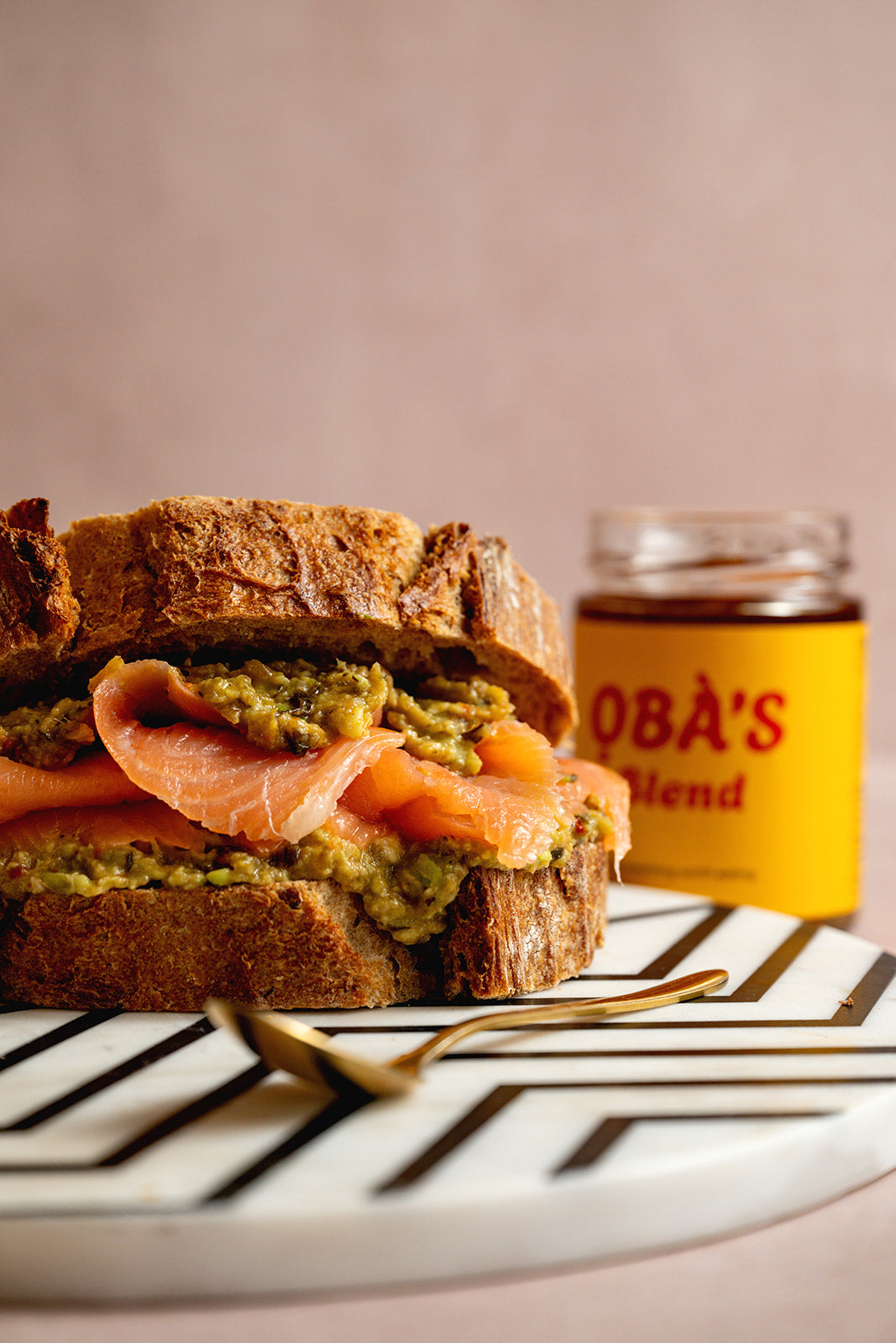 The ỌBÀ Stack — ỌBÀ'S BLEND smashed avocado and smoked salmon on thick toasted sourdough